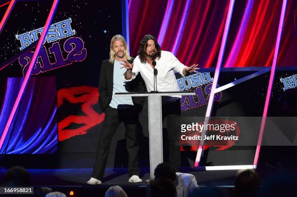 Musicians Dave Grohl and Taylor Hawkins onstage at the 28th Annual Rock and Roll Hall of Fame Induction Ceremony at Nokia Theatre L.A. Live on April...
