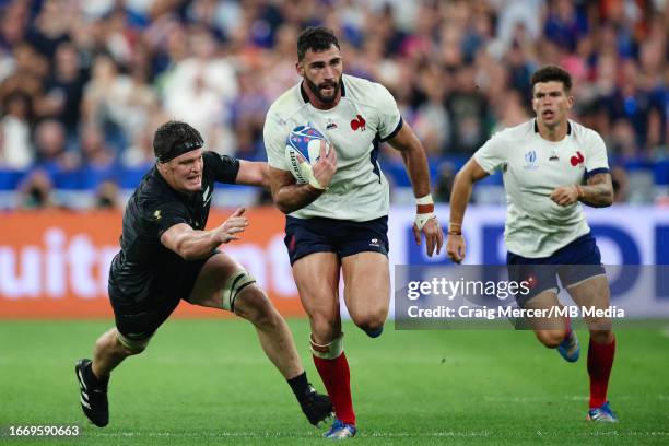 Charles Ollivon of France evades the tackle of Scott Barrett of New Zealand during the Rugby World Cup France 2023 match between France and New...