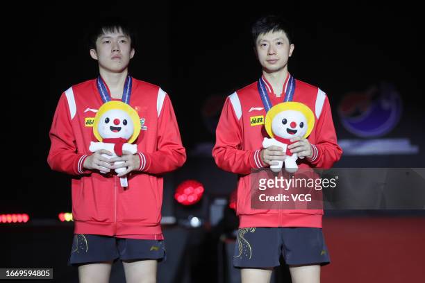 Silver medalists Wang Chuqin and Ma Long of China pose during medal ceremony for the Men's Doubles final match on day 7 of 2023 Pyeongchang Asian...