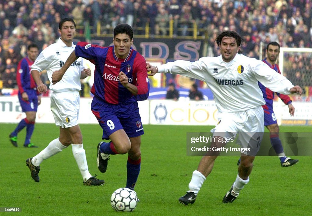 Julio Cruz of Bologna and Omar Milanetto of Modena in action...