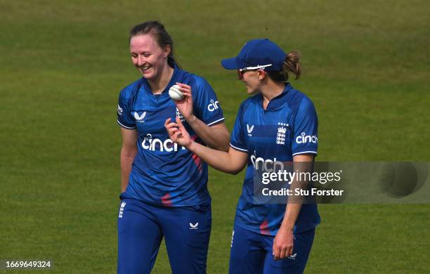 England bowler Lauren Filer shares a joke with Kate Cross during the 1st Metro Bank ODI between England and Sri Lanka at Seat Unique Riverside on...