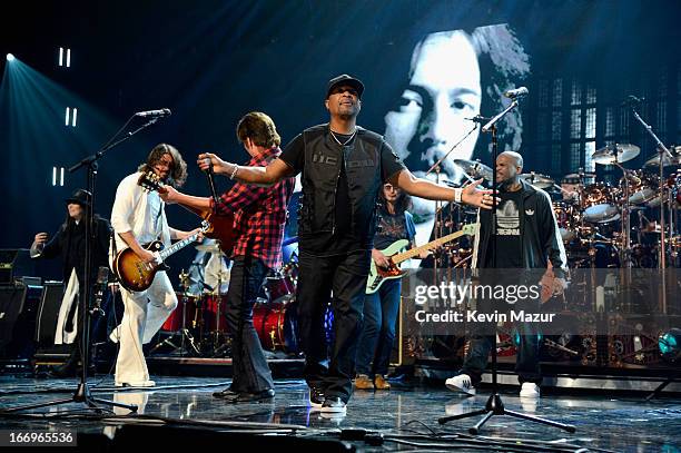Inductee Ann Wilson, musician Dave Grohl, musician John Fogerty, inductee Chuck D, inductee Geddy Lee and rapper Darryl McDaniels perform onstage...