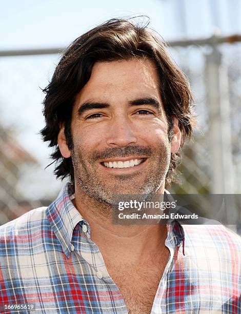 Television personality Carter Oosterhouse celebrates Earth Day with the Environmental Media Association at Cochran Middle School on April 18, 2013 in...