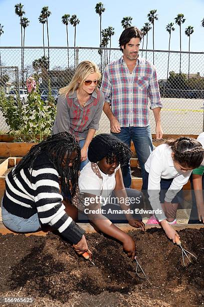 Actress Amy Smart and television personality Carter Oosterhouse celebrate Earth Day with the Environmental Media Association at Cochran Middle School...