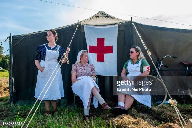Group of women is seen performing as nurses from the WWII era, during the Recreation of the Waal River crossing during WWII in Nijmegen, on September...
