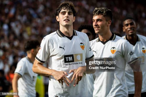 Javi Guerra of Valencia CF celebrate after scoring the 3-0 goal with his teammate during La Liga match between Valencia CF and AT de Madrid at...