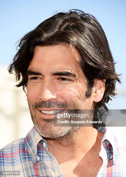 Television personality Carter Oosterhouse celebrates Earth Day with the Environmental Media Association at Cochran Middle School on April 18, 2013 in...