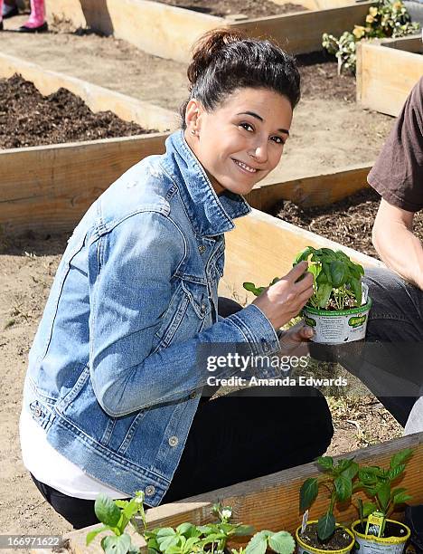 Actress Emmanuelle Chriqui celebrates Earth Day with the Environmental Media Association at Cochran Middle School on April 18, 2013 in Los Angeles,...