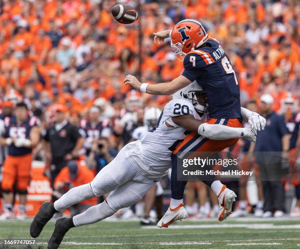 Adisa Isaac of the Penn State Nittany Lions makes the hit on Luke Altmyer of the Illinois Fighting Illini during the second half at Memorial Stadium...