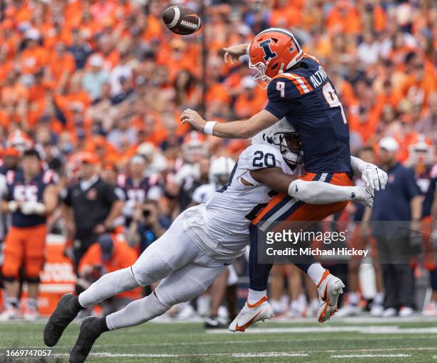 Adisa Isaac of the Penn State Nittany Lions makes the hit on Luke Altmyer of the Illinois Fighting Illini during the second half at Memorial Stadium...