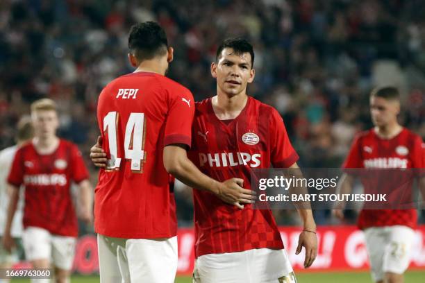 Eindhoven US forward Ricardo Pepi and teammate Mexico's forward Hirving Lozano celebrate their 4th goal during the Dutch Eredivisie match between PSV...