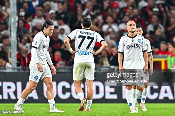 Piotr Zielinski , Khvicha Kvaratskhelia, Stanislav Lobotka and Mario Rui of Napoli react with disappointment after Mateo Retegui of Genoa has scored...