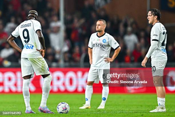 Victor Osimhen , Stanislav Lobotka and Piotr Zielinski of Napoli react with disappointment after Mateo Retegui of Genoa has scored a goal during the...