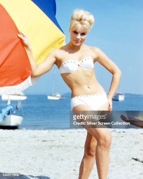 German actress Elke Sommer wearing a bikini on a beach, circa 1963.
