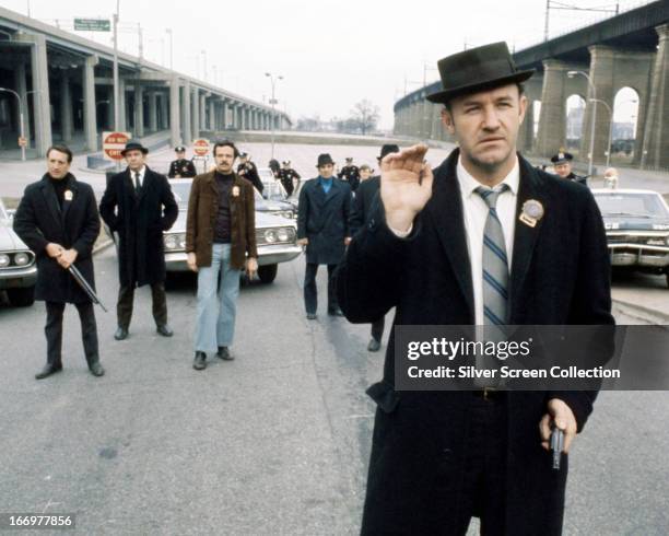 American actor Gene Hackman as Jimmy 'Popeye' Doyle in 'The French Connection', directed by William Friedkin, 1971. In the background is Roy Scheider...