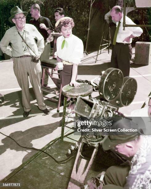 English-American actress and director Ida Lupino with a film crew on a set, circa 1945.