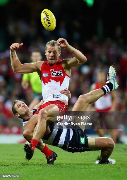 Ryan O'Keefe of the Swans is tackled by Joel Selwood of the Cats during the round four AFL match between the Sydney Swans and the Geelong Cats at the...