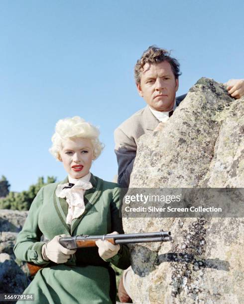 English actor Kenneth More as Jonathan Tibbs, and American actress Jayne Mansfield as Kate, in 'The Sheriff of Fractured Jaw', directed by Raoul...
