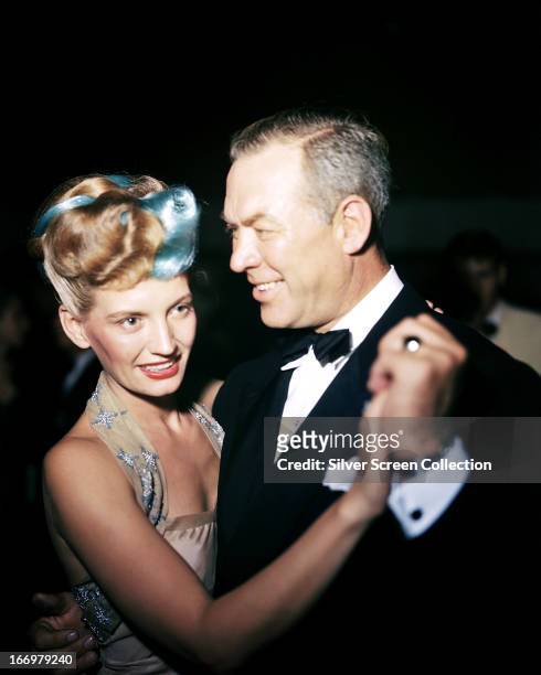 American actor Ward Bond with a dance partner, circa 1950.