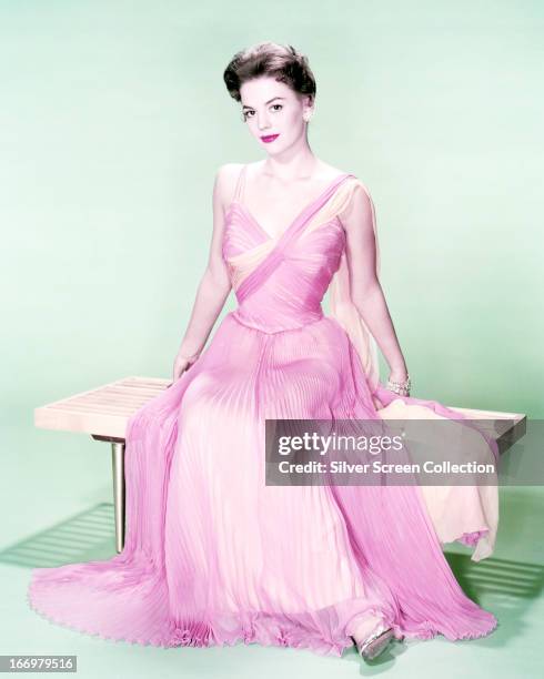 American actress Natalie Wood wearing a ruched, pink evening dress, circa 1960.