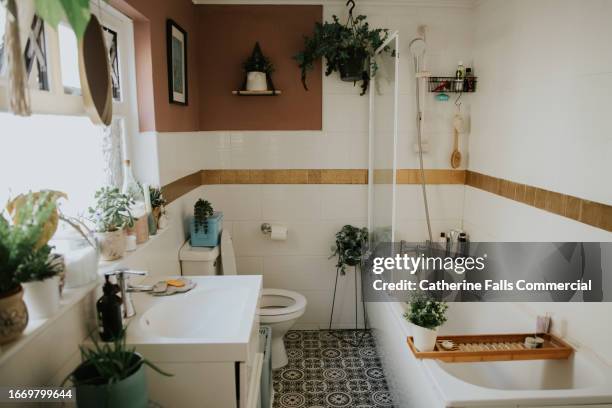 a stylish, tidy, organised domestic bathroom - domestic bathroom stock pictures, royalty-free photos & images