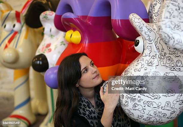 Fundraising manager Lauren Vincent poses with four Gromit sculptures, out of around 70 which have been painted by celebrity artists, Sir Paul Smith,...