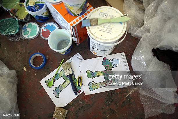 Paints and plans are seen near a Gromit sculpture, of around 70, some of which have been painted by celebrity artists, left to right, Sir Paul Smith,...