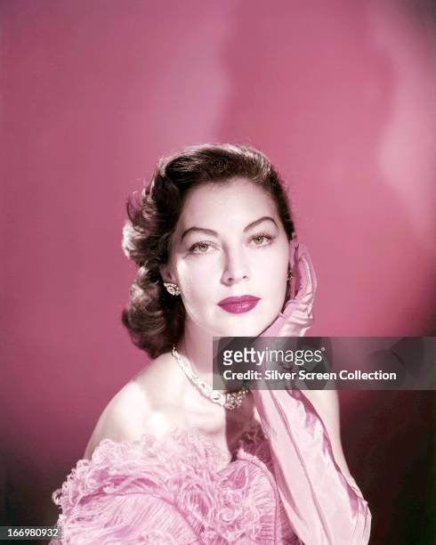 American actress Ava Gardner wearing pink evening gloves, circa 1950.