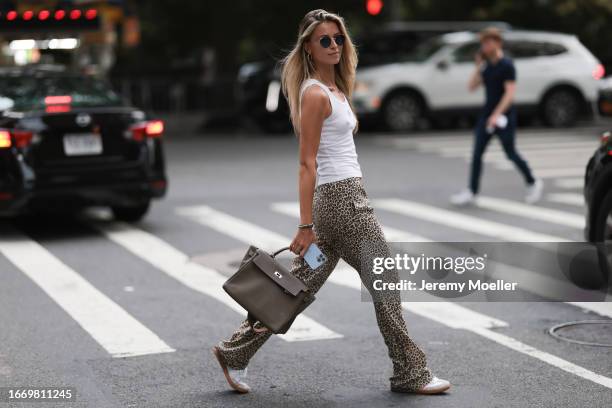 Karin Teigl wearing Prada denim dress and white Hermes Kelly leather  News Photo - Getty Images