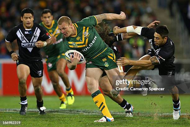 Luke Lewis of the Kangaroos makes a break during the ANZAC Test match between the Australian Kangaroos and the New Zealand Kiwis at Canberra Stadium...