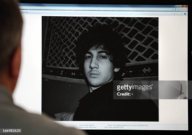 Man looks in Moscow on April 19 at a computer screen displaying an undated picture the 19-year-old Dzhokhar Tsarnaev posted on his is page in...