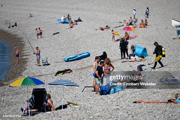 Beachgoers enjoy the hot weather at Chesil beach, on September 09, 2023 in Portland, England. The UK is experiencing a late summer heatwave as...