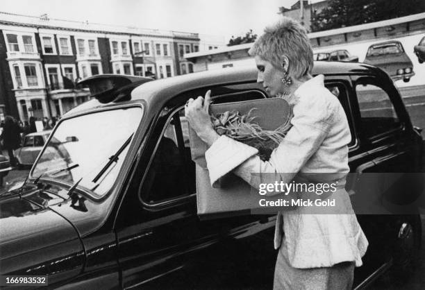 American model and actress Angie Bowie arrives at the Earl's Court Exhibition Centre, London, before a concert by her husband, David Bowie, on his...