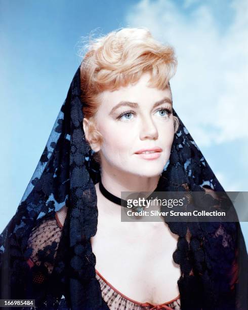 American actress Dorothy Malone as Lily Dollar in a promotional portrait for 'Warlock', directed by Edward Dmytryk, 1959.