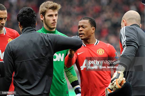 Luis Suarez of Liverpool refuses to shake the hand of Patrice Evra of Manchester United ahead of the Barclays Premier League match between Manchester...