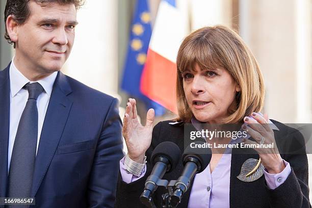 Newly-appointed head of the "Innovation 2030" commission for technology and industry, Anne Lauvergeon addresses reporters beside French Minister for...