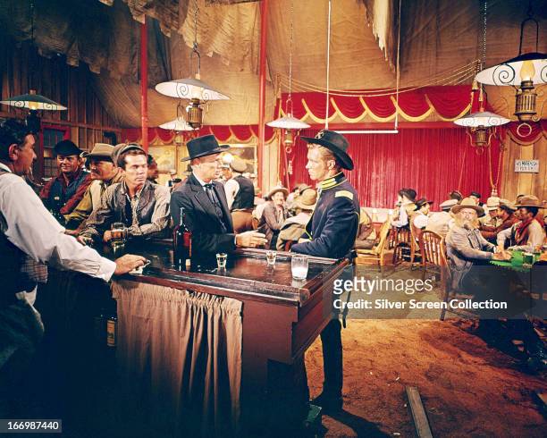 American actors Richard Widmark , as Mike King, and George Peppard as Zeb Rawlings, in 'How The West Was Won', directed by Henry Hathaway, 1962.