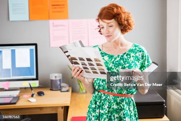 designer looking at design in office. - storyboard stock pictures, royalty-free photos & images