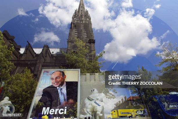 Picture of Clermont-Ferrand's Cathedral taken 31 May 2006 throw the window of a Michelin's shop, as thousands people attend the funeral of Michelin...