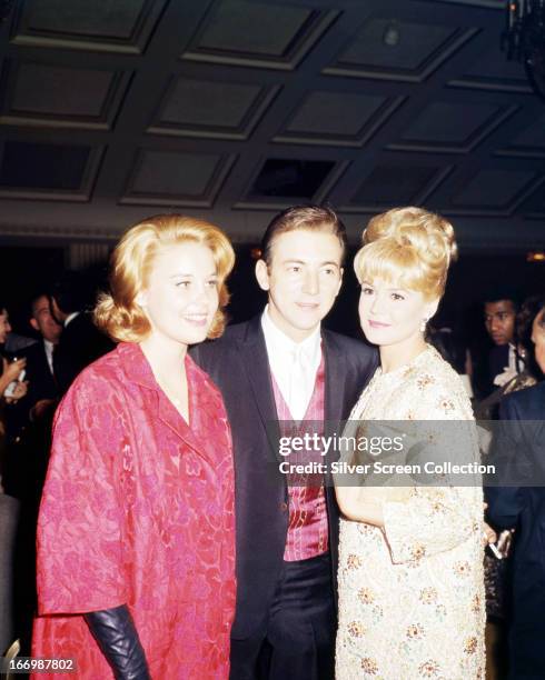 American singer Bobby Darin with his wife, actress Sandra Dee and actress Cheryl Miller at the 23rd Golden Globe Awards, USA, 28th February 1966.