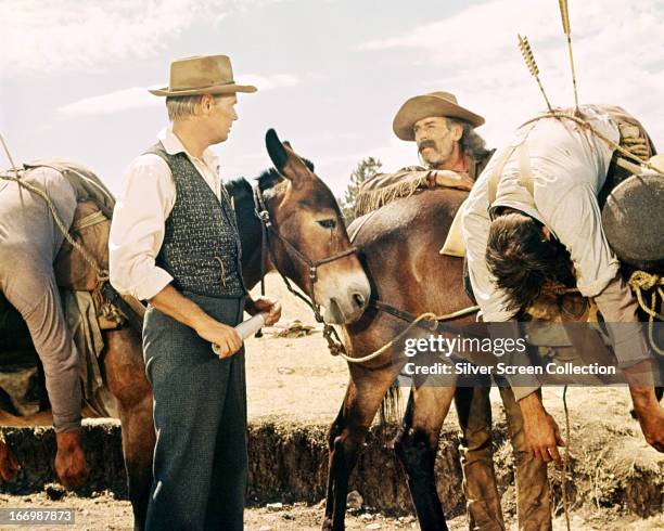American actors Richard Widmark , as Mike King, and Henry Fonda as Jethro Stuart, in 'How The West Was Won', directed by Henry Hathaway, 1962.