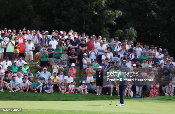 Shane Lowry of Ireland putts on the 12th green as crowds look on during Day Three of the Horizon Irish Open at The K Club on September 09, 2023 in...