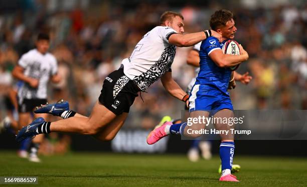 Tom Cairns of Exeter Chiefs breaks the tackle of Fred Davies of Bristol Bears to score their sides fourth try during the Premiership Rugby Cup match...