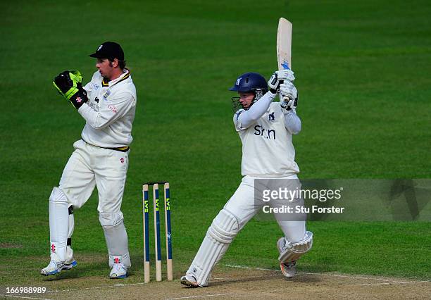 Warwickshire batsman Tim Ambrose cuts a ball to the boundary watched by Durham keeper Phil Mustard during day three of the LV County Championship...