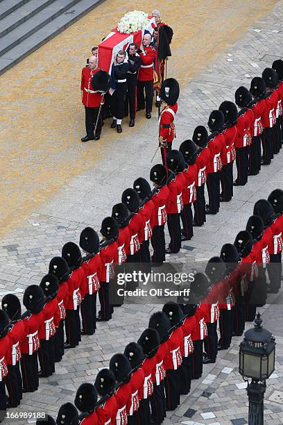 Members of the Armed Services carry the coffin during the Ceremonial funeral of former British Prime Minister Baroness Thatcher at St Paul's...