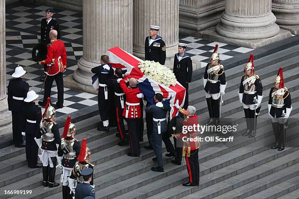 Members of the Armed Services carry the coffin during the Ceremonial funeral of former British Prime Minister Baroness Thatcher at St Paul's...