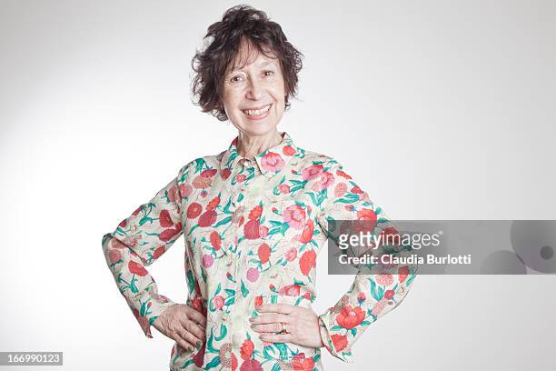 happy old lady - floral pattern shirt stock-fotos und bilder