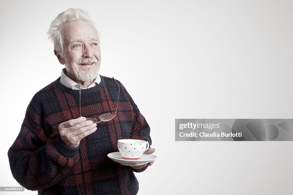 Happy Old Man Drinking Tea