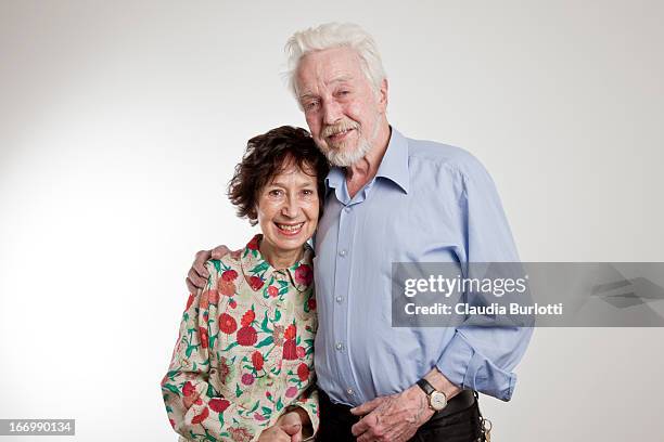 happy elderly couple hugging - couple portrait on white stock pictures, royalty-free photos & images