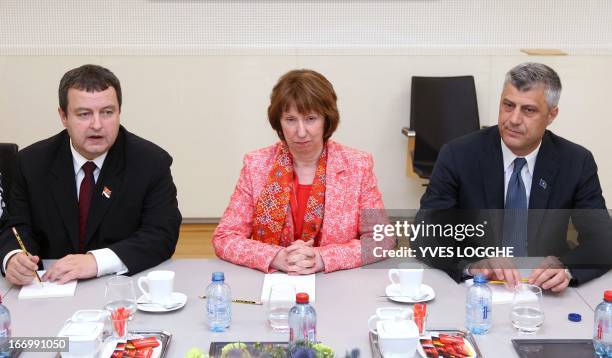 Kosovo's Prime Minister Hashim Thaci and Serbian Prime Minister Ivica Dacic pose with EU foreign policy chief Catherine Ashton at the NATO...